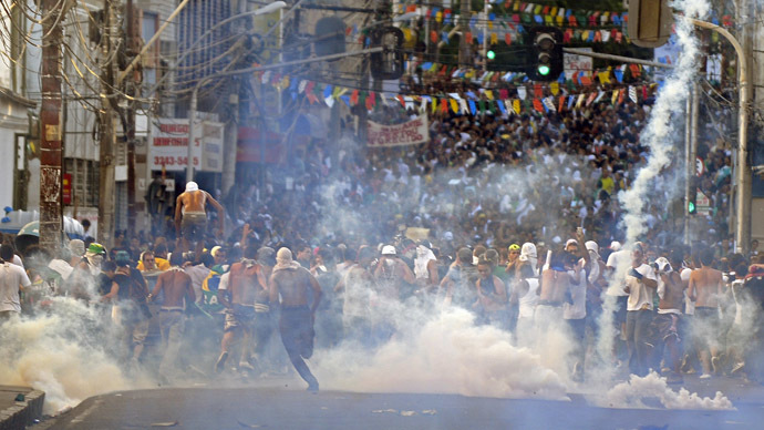 Protester killed, dozens injured as Brazil police face off with a million in 100 cities
