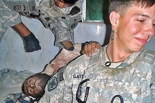 Photos of U.S. soldiers posing with Afghan corpses prompt condemnation
