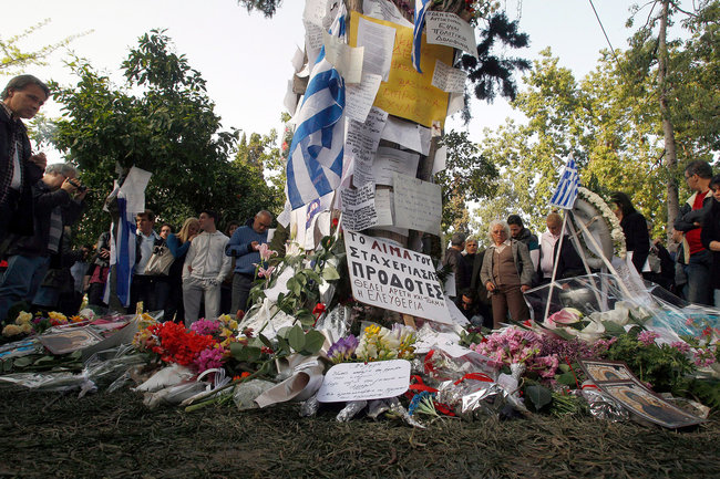 Greece: Clash after service for man who shot self