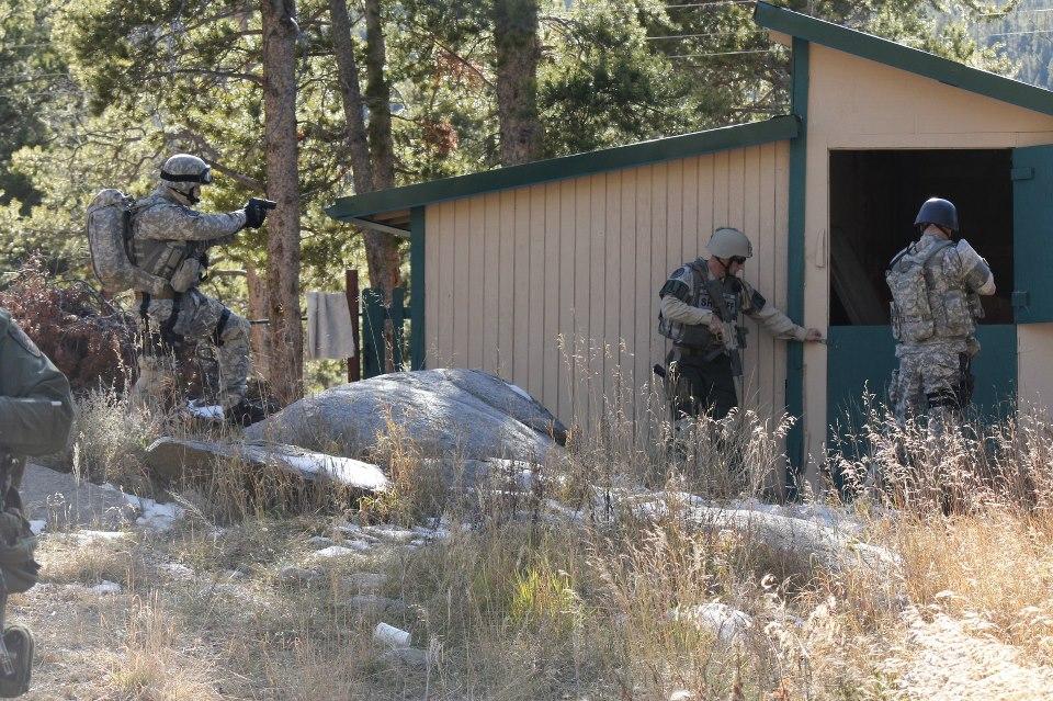Police militarization in Colorado: Cops in fatigues toting automatic weapons disperse anti-eviction activists