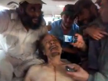 ‘Send this to Assad’: New shock video shows rebels mocking Gaddafi body
